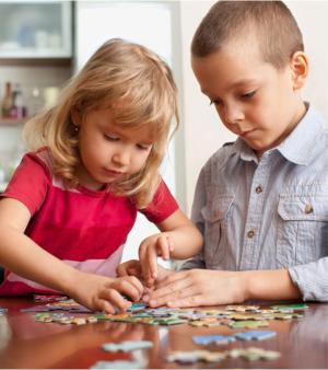 two children playing puzzles