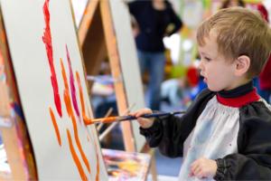 cute little boy painting